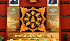 Banner atau spanduk acara Rayakan Lebaran Yatim GEBYAR AS - SYURO 1448 di Gedung Graha Wisata Desa BMJ Mojopahit Mojokerto